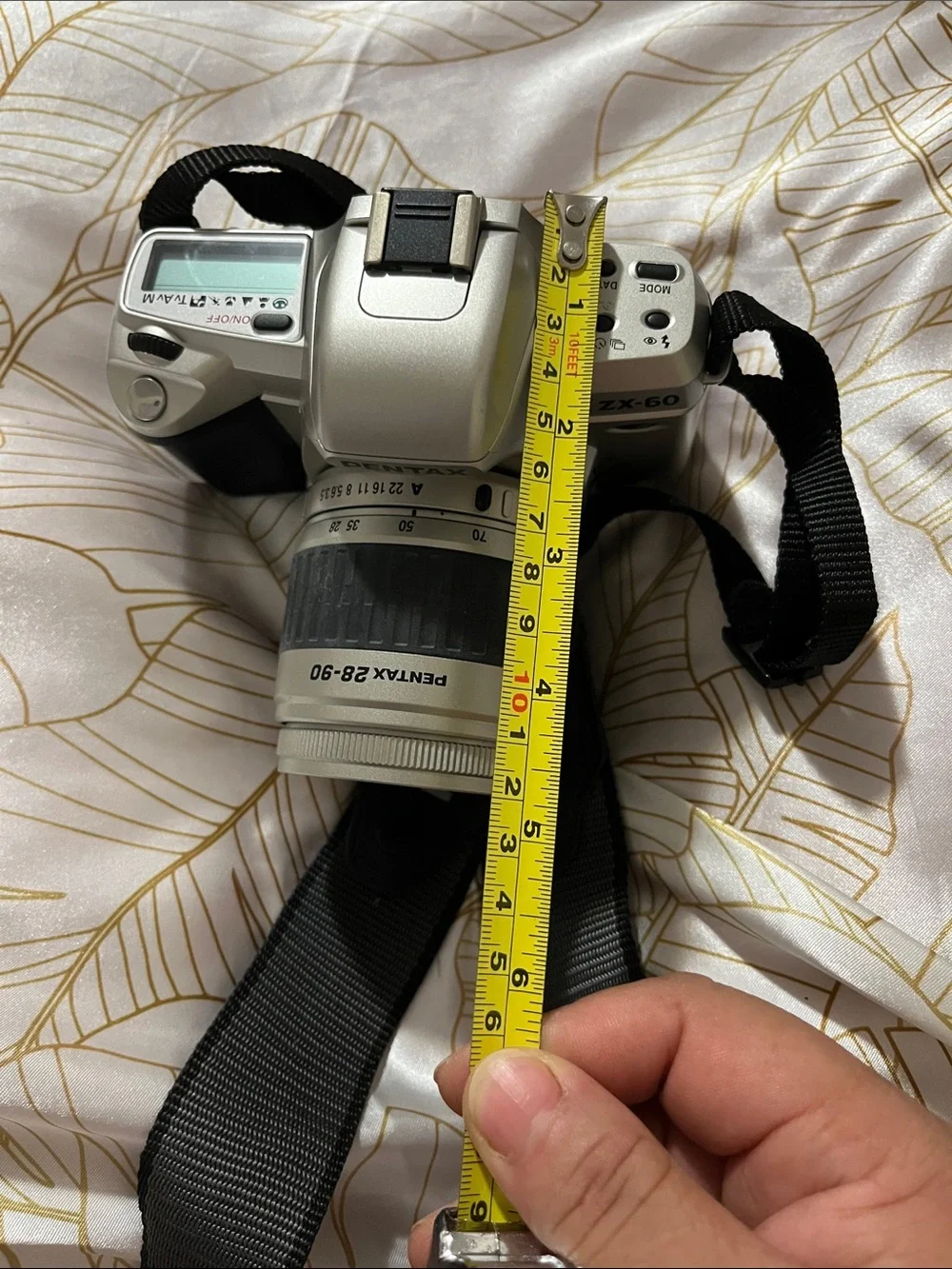 Pentax Silver and Black DSLR with 28-90mm Zoom Lens and Branded Strap